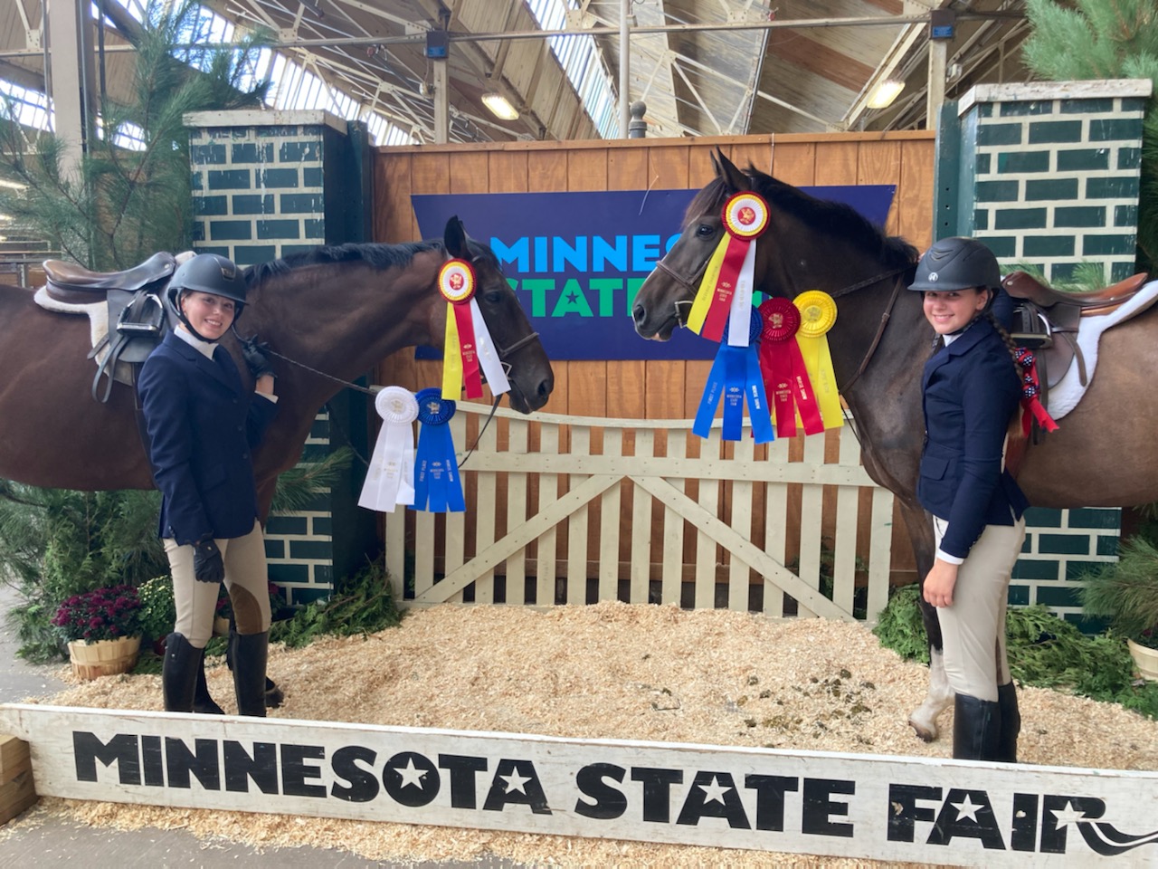 Seventh Farm horses and riders displaying their awards at the Minnesota State Fair
